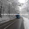 A truck of Virgin Wood Pellets Silver Fir is rushing through a winter forests of Bukovina to retail consumers